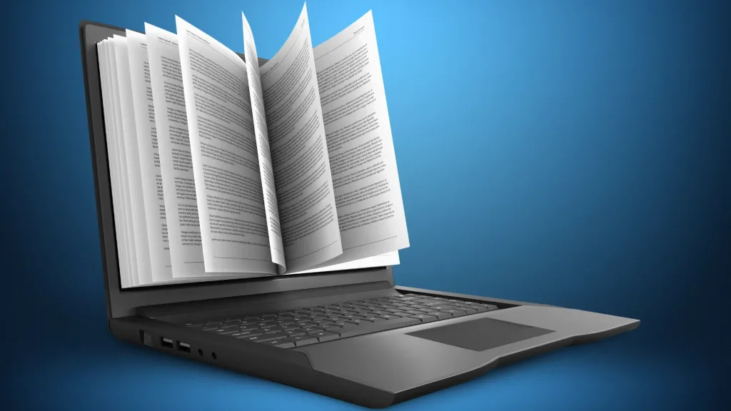 image-article-livre-narratif Un ordinateur est posé, ouvert, sur un fond bleu. Un livre dont les pages se tournent fait office d'écran.